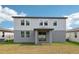 Backyard view of the home highlighting the rear exterior and well-maintained lawn at 4705 Jasmine Cir, Leesburg, FL 34748