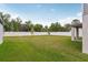 Spacious back yard features a well-maintained lawn and a tall privacy fence at 4721 Jasmine Cir, Leesburg, FL 34748