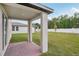 The backyard boasts a covered patio and green lawn at 4721 Jasmine Cir, Leesburg, FL 34748
