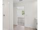 Bathroom with a walk-in shower and open view into the bedroom at 4721 Jasmine Cir, Leesburg, FL 34748
