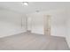 Bedroom featuring neutral carpet, white walls, and multiple doorways at 4721 Jasmine Cir, Leesburg, FL 34748