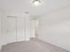 Bright bedroom featuring a closet with sliding doors at 4721 Jasmine Cir, Leesburg, FL 34748