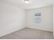 This is a clean bedroom with light colored walls and a window at 4721 Jasmine Cir, Leesburg, FL 34748