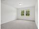 Bright bedroom with plush carpet and windows offering natural light at 4721 Jasmine Cir, Leesburg, FL 34748