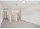 Hallway features neutral carpet and recessed lighting at 4721 Jasmine Cir, Leesburg, FL 34748
