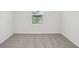 A walk-in closet with shelving and a window for natural light at 4721 Jasmine Cir, Leesburg, FL 34748