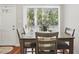 Dining area with table, chairs, and sliding glass door providing natural light at 4870 Conway Rd # 106, Orlando, FL 32812