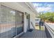 Condo entryway with sliding glass door and storm door leading to a private balcony at 4870 Conway Rd # 106, Orlando, FL 32812