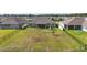 Aerial view of the property highlighting the large fenced yard, patio, and beautiful landscaping at 521 Sanctuary Blvd, Winter Haven, FL 33881