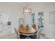 Cozy breakfast nook with round table, elegant chairs, and natural light streaming in at 521 Sanctuary Blvd, Winter Haven, FL 33881