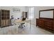 Bright home office with desk, built-in shelves, and stylish decor create an ideal work-from-home environment at 521 Sanctuary Blvd, Winter Haven, FL 33881