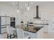 Modern kitchen featuring a black countertop island with a sink, and stainless steel appliances at 521 Sanctuary Blvd, Winter Haven, FL 33881