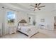 Relaxing main bedroom with a plush bed, stylish decor, and scenic outdoor views at 521 Sanctuary Blvd, Winter Haven, FL 33881