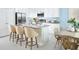 Modern kitchen featuring stainless steel appliances, granite countertops, and a breakfast bar at 523 Silver Palm Dr, Haines City, FL 33844