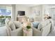 Cozy living room featuring comfortable seating, natural light, and stylish decor at 523 Silver Palm Dr, Haines City, FL 33844