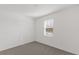 Bright bedroom with neutral carpet and a window that allows natural light to fill the space at 527 Silver Palm Dr, Haines City, FL 33844
