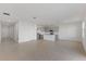 Open-concept living space with tile flooring and views of the modern kitchen, ideal for entertaining at 527 Silver Palm Dr, Haines City, FL 33844