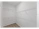 Organized walk-in closet with ample shelving, maximizing storage space at 527 Silver Palm Dr, Haines City, FL 33844