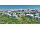 Aerial of beachside condos with community pools, tennis courts and well maintained landscaping in a desirable location at 5300 S Atlantic Ave # 2-505, New Smyrna Beach, FL 32169