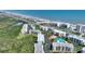 Stunning aerial view of beachfront condos, highlighting ocean access, amenities, and lush landscaping in a coastal community at 5300 S Atlantic Ave # 2-505, New Smyrna Beach, FL 32169