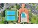 An aerial view of the community pool, tennis court, and shuffleboard court at 5300 S Atlantic Ave # 2-505, New Smyrna Beach, FL 32169