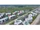 Breathtaking aerial view of oceanfront condos showcasing the community's beautiful landscaping and access to the beach and marsh at 5300 S Atlantic Ave # 2-505, New Smyrna Beach, FL 32169