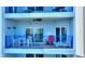Inviting balcony with ocean view, seating, and 'Life's a Beach' decor for a relaxing outdoor living space at 5300 S Atlantic Ave # 2-505, New Smyrna Beach, FL 32169