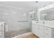 Bathroom featuring marble walls, a glass shower, and a double vanity to make this room the perfect oasis at 5300 S Atlantic Ave # 2-505, New Smyrna Beach, FL 32169