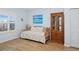 Bedroom featuring a twin bed, ocean view, natural light and display cabinet at 5300 S Atlantic Ave # 2-505, New Smyrna Beach, FL 32169