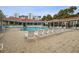 Tranquil community pool with ample lounge seating, shaded seating areas, and lush landscaping, perfect for relaxation at 5300 S Atlantic Ave # 2-505, New Smyrna Beach, FL 32169
