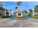Secure entrance gate welcomes you to a condo community with lush landscaping, mature palms and beach access at 5300 S Atlantic Ave # 2-505, New Smyrna Beach, FL 32169