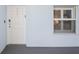 Exterior shot of the home's entrance with white front door and window at 5300 S Atlantic Ave # 2-505, New Smyrna Beach, FL 32169