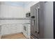 Stylish kitchen with stainless steel appliances, white cabinets, and plenty of counter space at 5300 S Atlantic Ave # 2-505, New Smyrna Beach, FL 32169