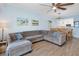 Spacious living room with a comfortable sectional sofa, dining table, and kitchen view at 5300 S Atlantic Ave # 2-505, New Smyrna Beach, FL 32169
