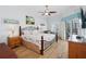 Main bedroom offers a king-sized bed, balcony access, and a serene coastal-inspired decor at 5300 S Atlantic Ave # 2-505, New Smyrna Beach, FL 32169