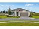 Charming single-Gathering home with a two-car garage, well-maintained lawn, and beautiful landscaping at 531 Silver Palm Dr, Haines City, FL 33844