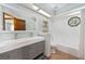 Modern bathroom with a double sink vanity and a tiled shower and tub at 5330 Keswick Ct, Orlando, FL 32812