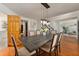 Inviting dining room with a wooden table, chandelier, and hardwood floors at 5330 Keswick Ct, Orlando, FL 32812