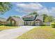 Lovely two-story home with a charming exterior, lush landscaping, and inviting curb appeal at 5330 Keswick Ct, Orlando, FL 32812