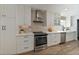 Bright kitchen with white cabinets, stainless steel appliances, and stylish backsplash at 5330 Keswick Ct, Orlando, FL 32812