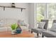 Comfortable living room with hardwood floors, stylish furniture, and a decorative shelf at 5330 Keswick Ct, Orlando, FL 32812