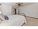 A bright main bedroom with soft carpet flooring and a ceiling fan at 5330 Keswick Ct, Orlando, FL 32812