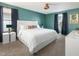 Comfortable bedroom with a queen-size bed, soft carpet, and ample natural light at 5416 Solterra Cir, Davenport, FL 33837