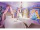 Charming bedroom with princess themed murals, canopy beds and modern lighting at 5416 Solterra Cir, Davenport, FL 33837