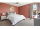 Well-lit bedroom with a comfortable bed, stylish decor, and calming color scheme at 5416 Solterra Cir, Davenport, FL 33837