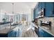 Spacious eat-in kitchen with stainless steel appliances and long island countertop at 5416 Solterra Cir, Davenport, FL 33837