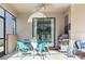 Cozy covered patio features a ceiling fan, grill, and outdoor seating area at 5416 Solterra Cir, Davenport, FL 33837