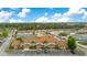 Aerial view showcases the community's amenities, including a tennis court and sparkling pool at 5763 Saint Christopher Dr # 55, Orlando, FL 32822