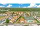 Expansive aerial view featuring the complex, a pool, tennis courts, and convenient parking at 5763 Saint Christopher Dr # 55, Orlando, FL 32822