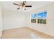 A bedroom with hardwood floors, a ceiling fan and a double window providing ample light at 5763 Saint Christopher Dr # 55, Orlando, FL 32822
